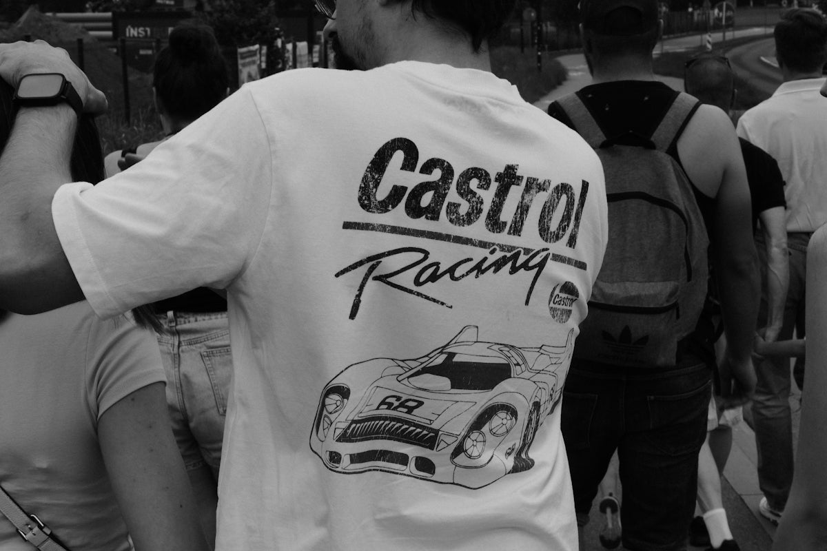 White t-shirt with castrol racing logo and car design.